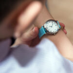 Boy looking at his wrist kid watch.