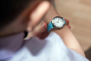 Boy looking at his wrist kid watch.